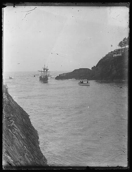 Masted ship enetering Looe harbour mouth