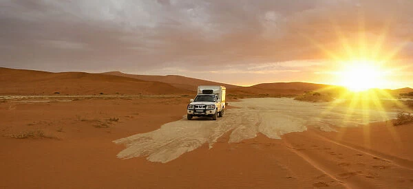 Dunes. 4x4 Camper driving to Sossusvlei, Namib Naukluft National Park