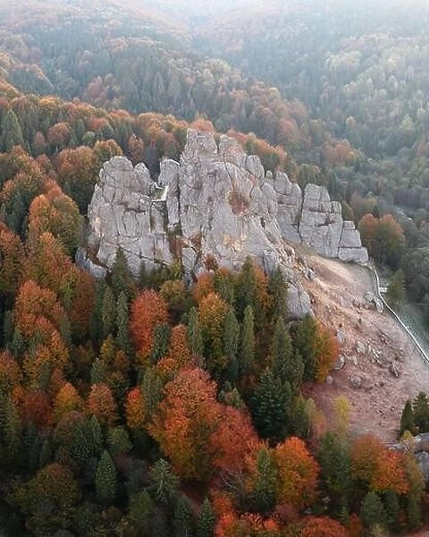 Aerial view from drone to Tustan fortress - archeological and natural monument of national significance in Urych village in autumn time, Ukraine