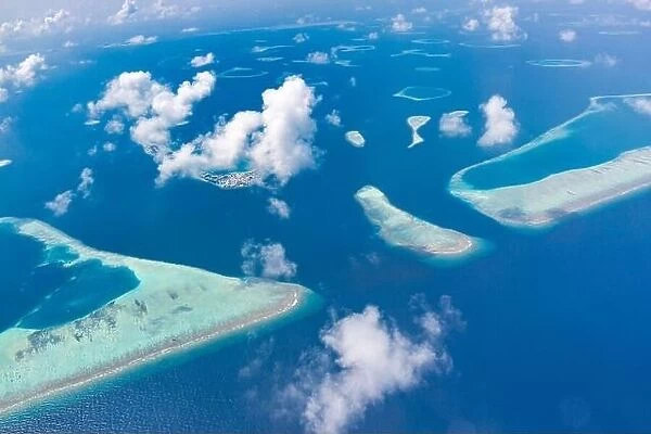 Aerial view of Maldives atolls is the world top beauty. Maldives tourism. Indian ocean with Maldivian island, aerial photography