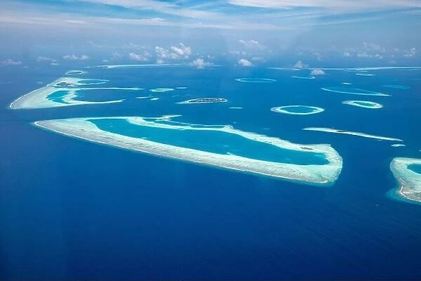 Beauty tropical island. Aerial view on tropical islands, drone, plane view from coral reef atoll in Maldives islands. Exotic travel nature destination