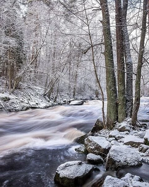Scenic landscape with flowing river at winter morning