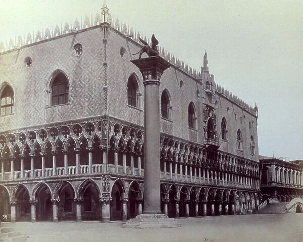 Angle shot of the south and west facades of the Doges Palace in Venice. In the foreground the column with the lion of St. Mark
