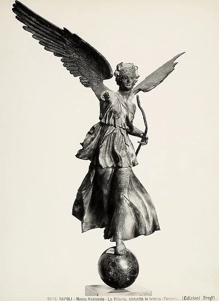 Bronze statuette of Winged Victory on a globe, located at the National Archaeological Museum in Naples