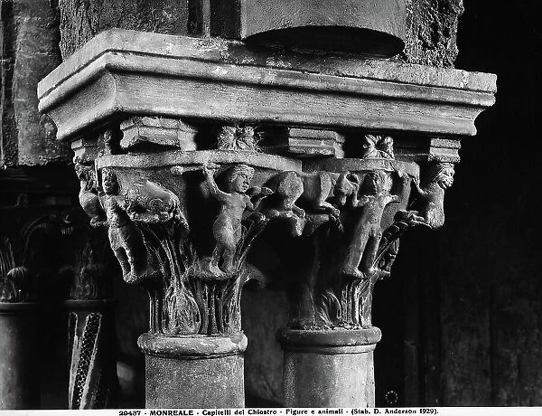 Two capitals with sculpted nude human figures in the cloister of the Cathedral of Monreale