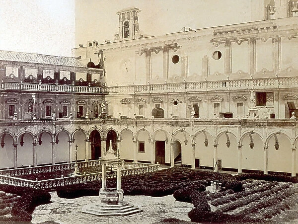 The Chiostro Grande of the Certosa of San Martino in Naples: in the foreground the octagonal well, surrounded by flowerbeds with hedges in the Italian style, a marble enclosure on the left; in the background, the walls of the Certosa