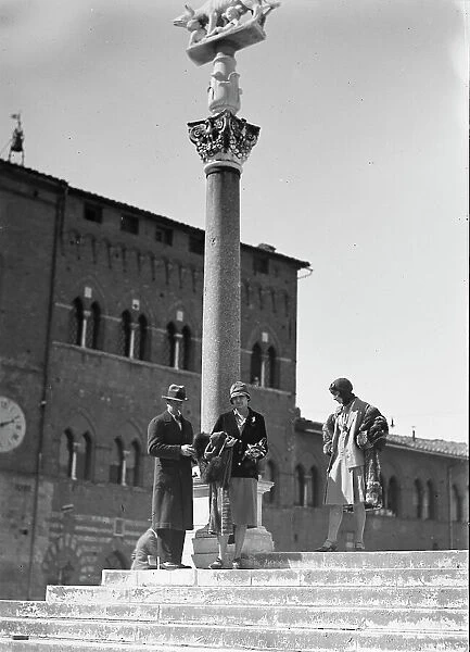 Group portrait in front of the column of the she-wolf of Siena, Siena