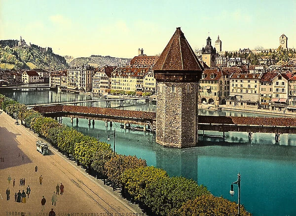 Kapellturm (or Wasserturm), octagonal tower on the river Reuss in Luzern. In the background, the Gtsch hill