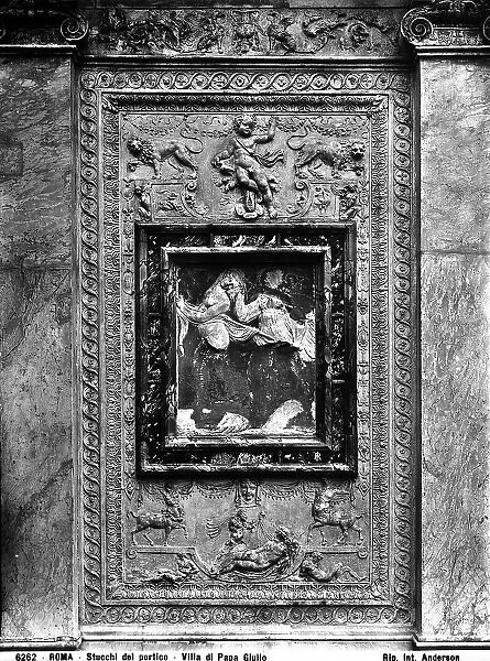 Panel with Manneristic stucco decoration, in the courtyard of Villa Giulia, Rome; in the center, a frame with two stucco figures