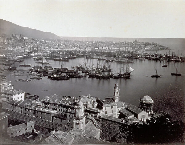 Panorama of the port of Genoa, Italy, with sail boats moored in the foreground