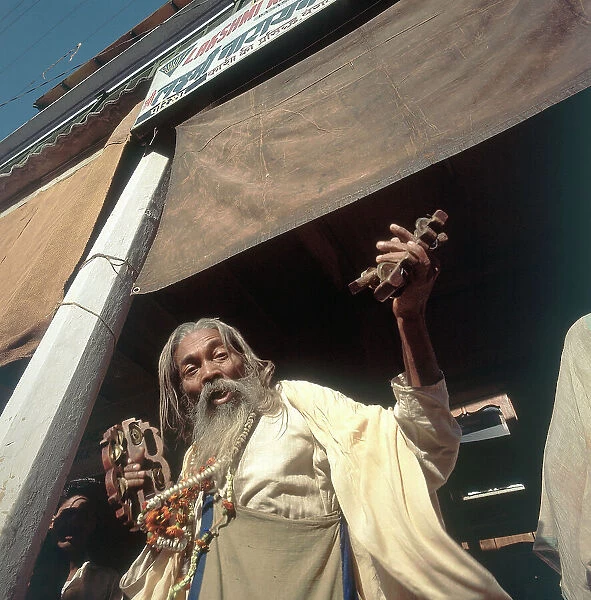 A pilgrim happily singing a religious hymn upon arriving in the holy city of Pandharpur, state of Maharashtra, India