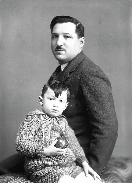 Portrait of a man with child