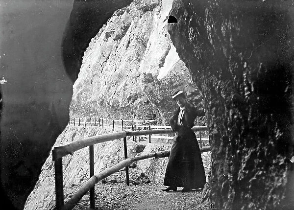 Portrait of a woman posing on a mountain path