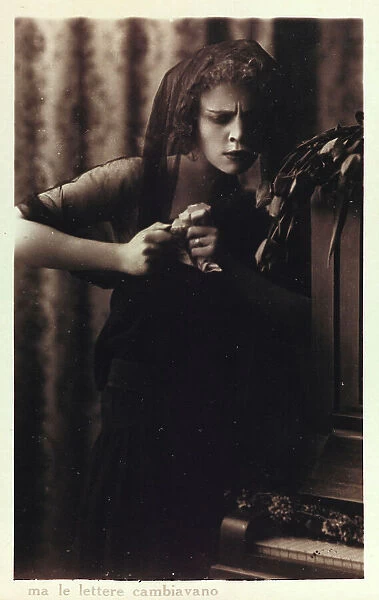 Portrait of a young woman holding a letter, postcard