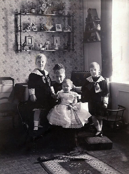 The queen Louise of Denmark together with her grandchildren, children of the prince Axel