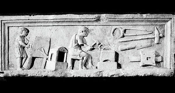 Relief of Roman era with the workshop of the blacksmith, exhibited in Rome at the Mostra Augustea of 1937-1938 in the Archaeological Museum in Aquileia