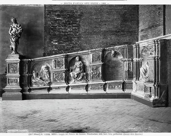 One side of the reliefs of the Fonte Gaia by Jacopo della Quercia. The image was taken on the occasion of the exhibition of ancient Sienese Art of 1904