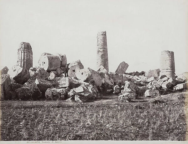 The remains of the Temple of Apollo in Selinunte. Two male figures can be seen on the collapsed columns