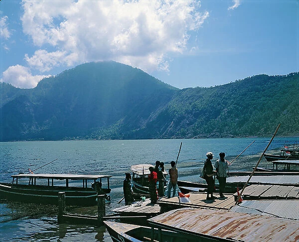Sunda Islands. Island of Bali. Shores, fishermen and boats on the shores of Lake Catur, in the eponymous volcano
