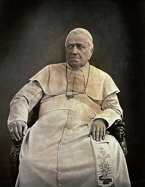 Three-quarter length portrait of Pius IX. The pope, in a white cassock, is seated on an armchair with finely carved armrests
