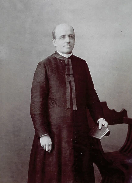 Three-quarter length portrait of a priest