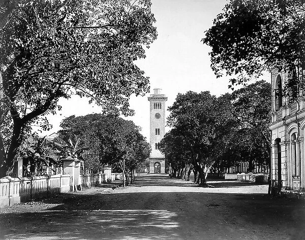 View of an avenue in Colombo, in the Isle of Sri Lanka (Ceylon). In the background, a clock tower