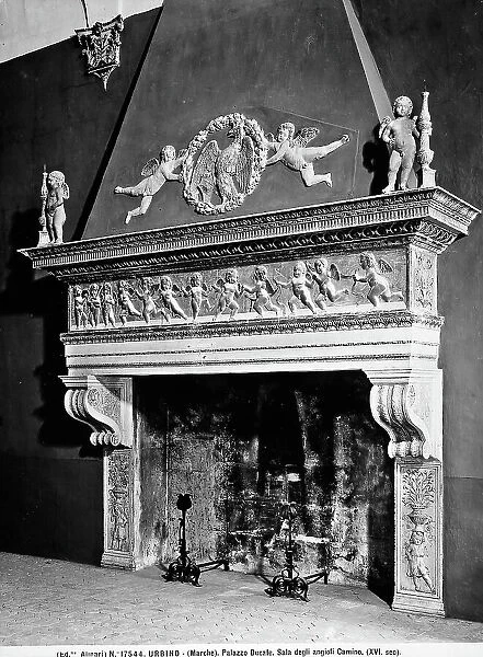 View of a fireplace with angels and an eagle inside a wreath; work located in the Room of the angels inside the Ducal Palace in Urbino