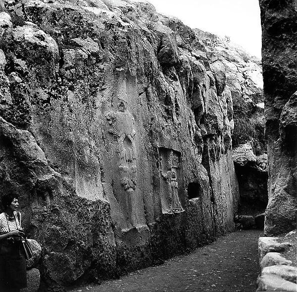 A wall with the figure of a god sculpted in the rock, in the Hittite sanctuary of Yazilikaya