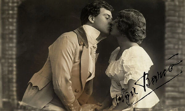 Young couple kissing, dressed in eighteen-hundreds costume