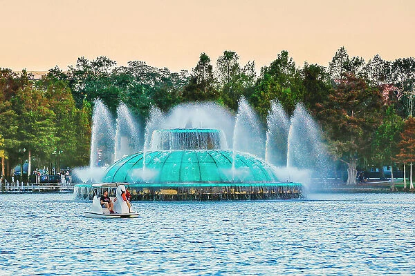Florida, Orlando, Lake Eola Park, Fountain and Swan paddle boat
