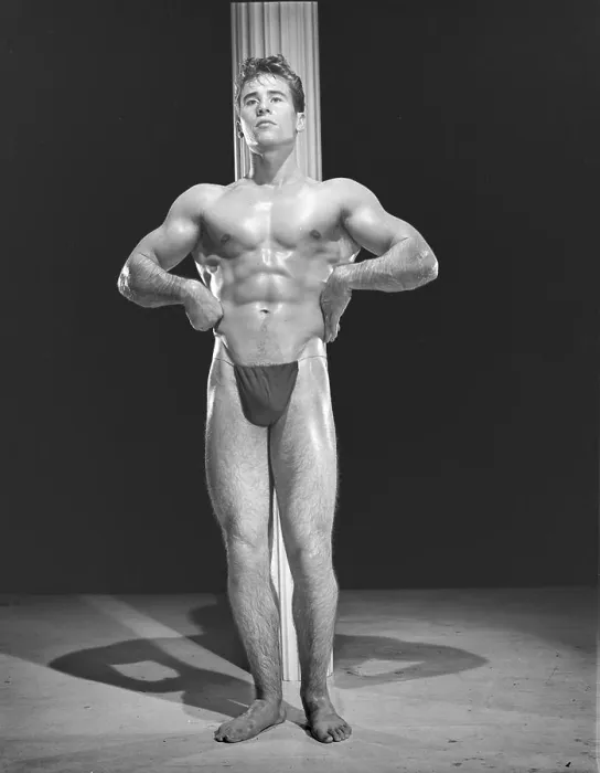Framed Print : Bodybuilder Poses In Front Of Pole c.1954 Print Framed Print : Bodybuilder Poses In Front Of Pole c.1954 Print
