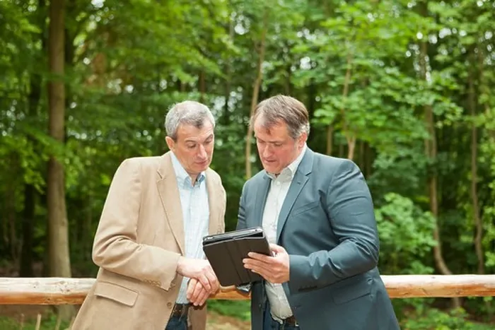 Framed Print : Businessmen Print on Tablet Computer Framed Print : Businessmen Print on Tablet Computer