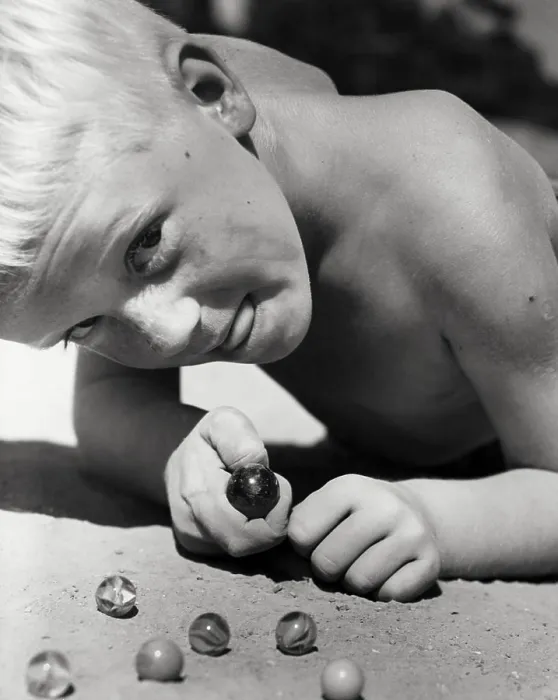Framed Print : Close-up Print of a Boy Playing Marbles