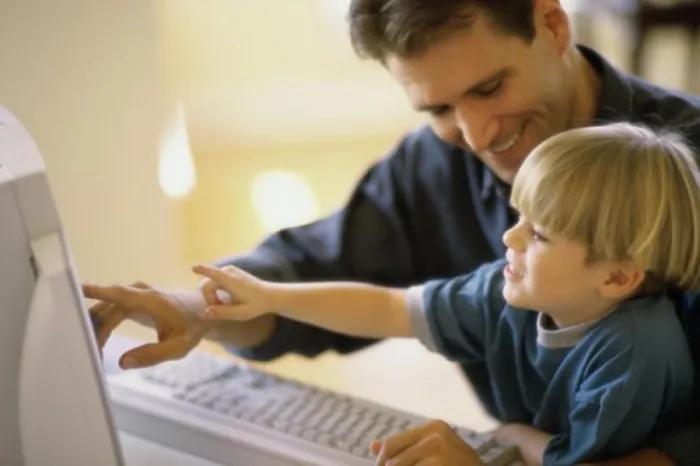 Framed Print : Side Profile Print of Father and Son Using Computer Framed Print : Side Profile Print of Father and Son Using Computer