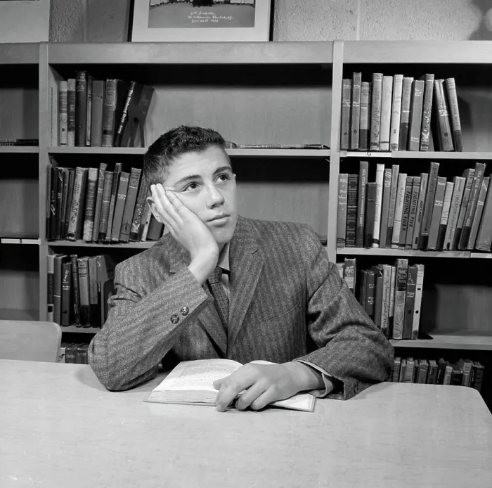 Framed Print : School boy reading in library Print Framed Print : School boy reading in library Print