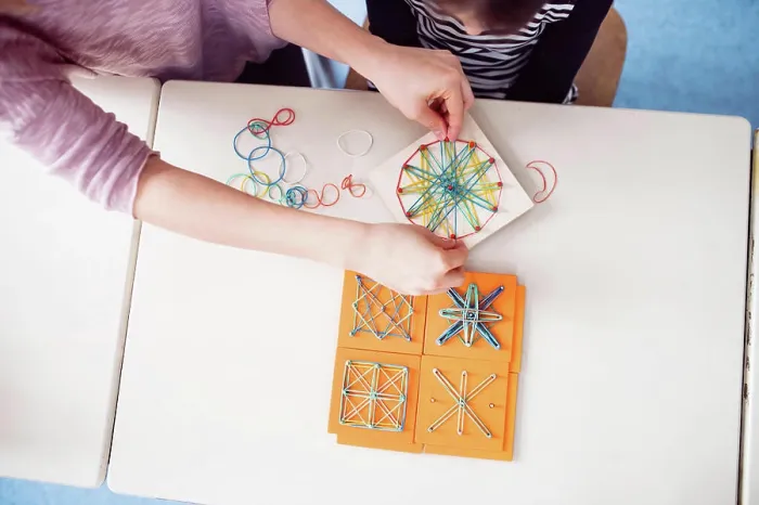Framed Print : Top View of Teacher Using Geoboard Print Framed Print : Top View of Teacher Using Geoboard Print