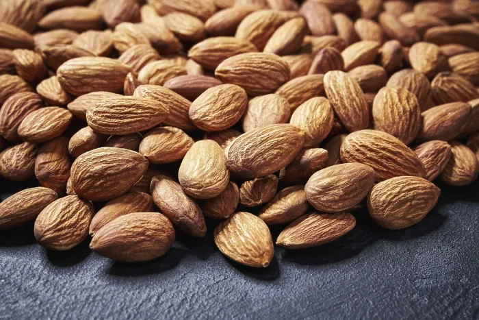 Framed Print : Almond Nuts Print on Black Table Framed Print : Almond Nuts Print on Black Table
