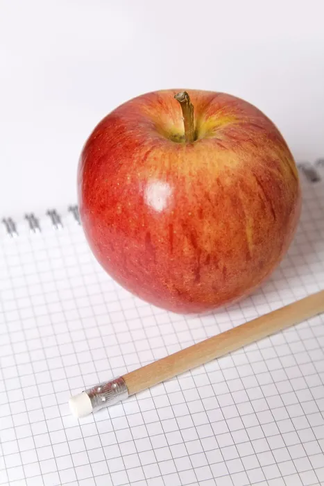 Framed Print : Apple and a pencil on a note block Print