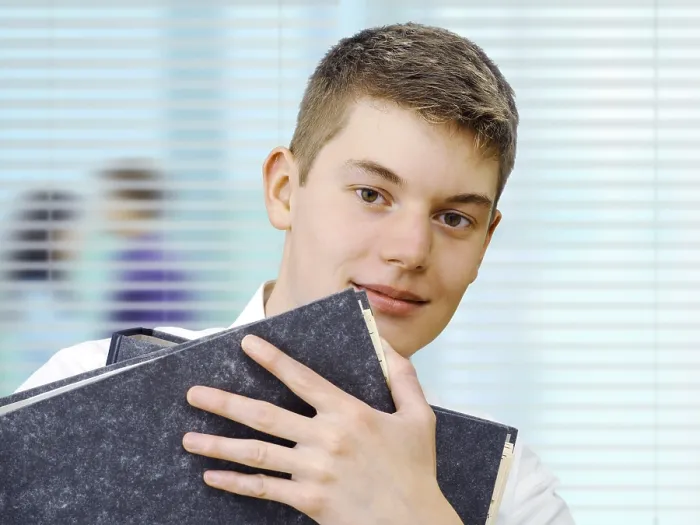 Framed Print : Office Apprentice Holding Files Print Framed Print : Office Apprentice Holding Files Print
