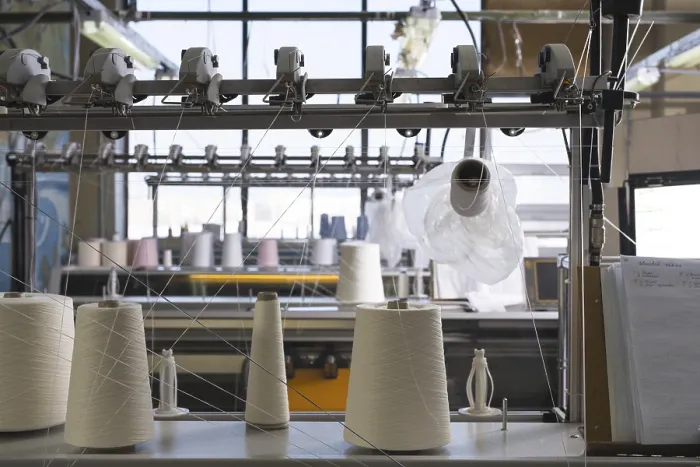 Framed Print : Rewinding Machine with White Thread Spools Print
