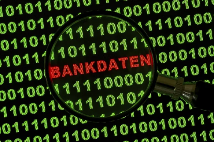 Framed Print : Bankdaten Binary Code Print viewed through a magnifying glass