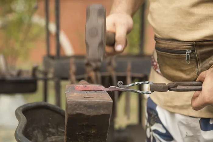Framed Print : Blacksmith Working on Metal Print