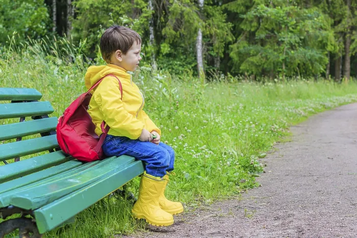 Framed Print : Relaxing Before School: A Boy with a Backpack Print