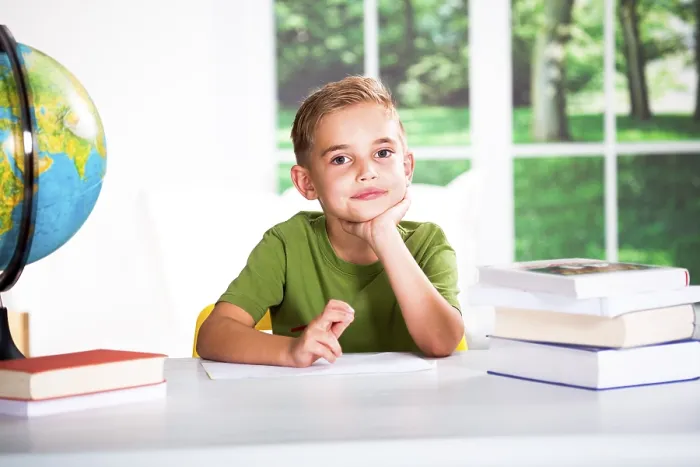 Framed Print : Boy with Books at a Table Print