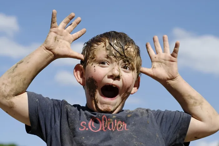 Framed Print : Boy covered with mud Print