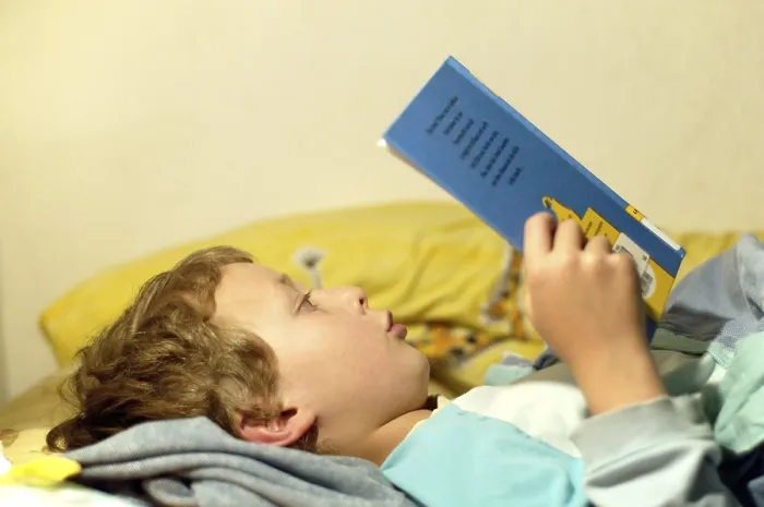 Framed Print : Boy Reading in Bed Print Framed Print : Boy Reading in Bed Print