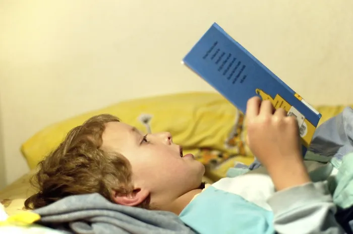 Framed Print : Boy Reading in Bed Print Framed Print : Boy Reading in Bed Print