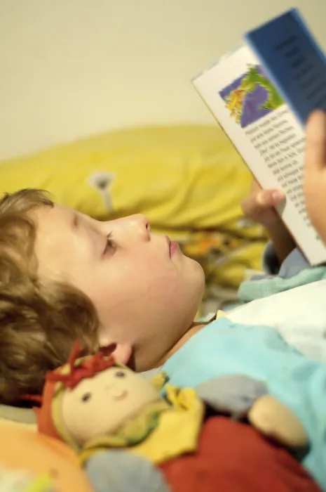 Framed Print : Boy Reading in Bed Print