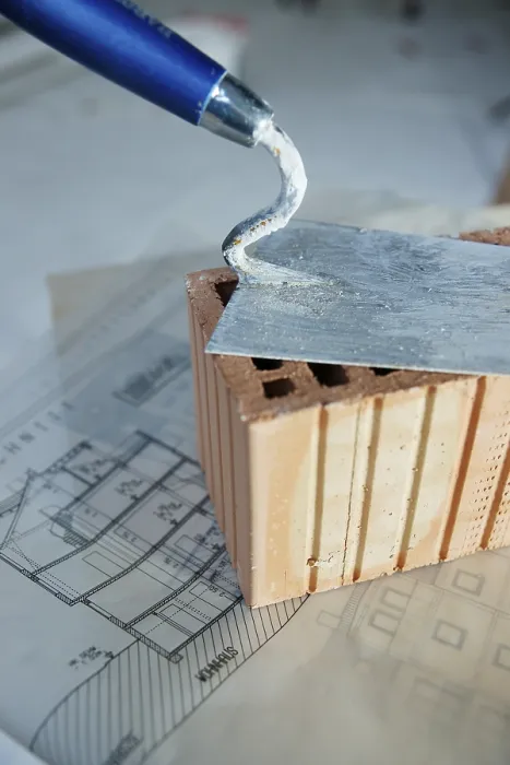 Framed Print : Brick Trowel and Brick on Construction Plan Print