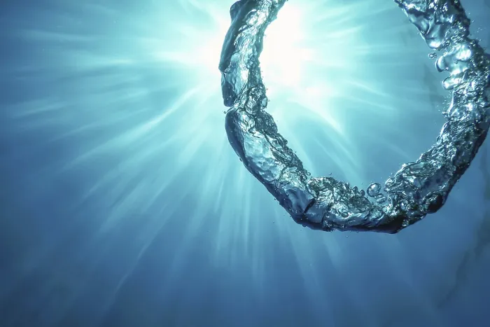 Framed Print : Bubble Ring Underwater Ascends Towards the Sun Print